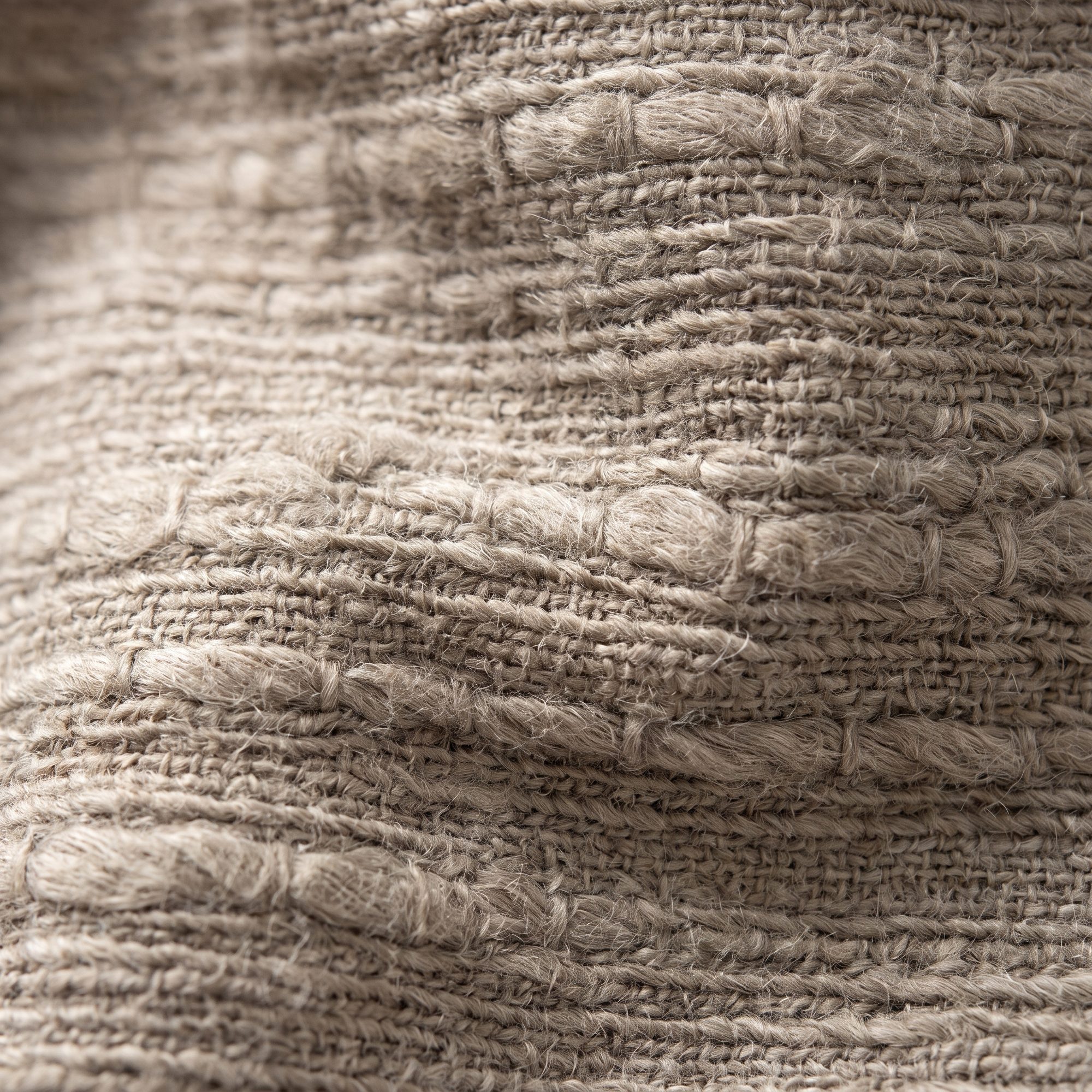 Close macro of slub jersey, the irregular yarn thickening across the face