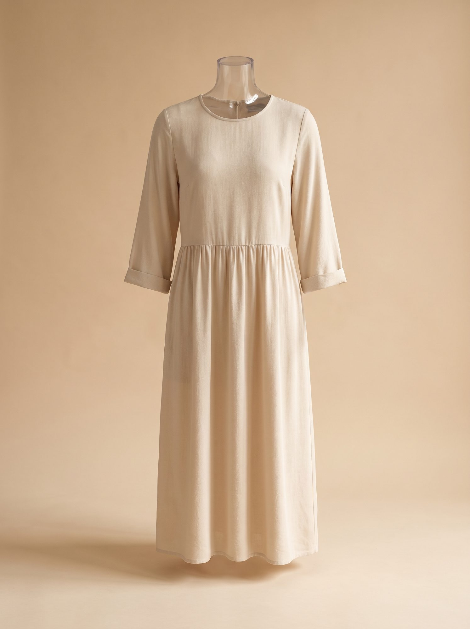 Cream gathered midi dress with three-quarter sleeves photographed full length