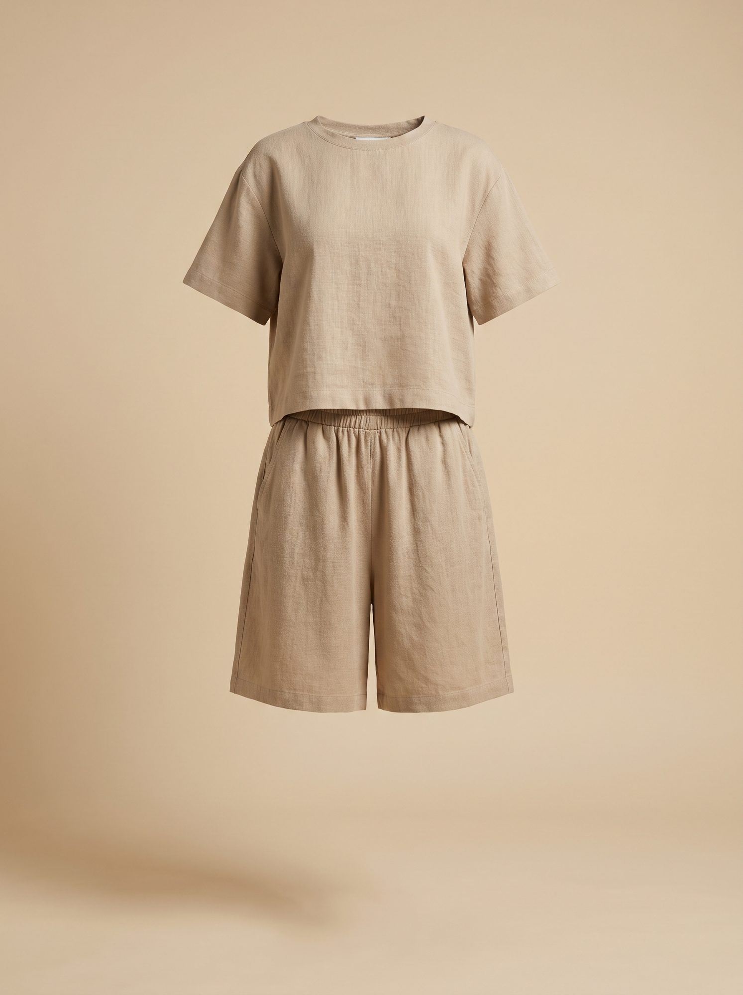 Natural linen co-ord set — boxy short-sleeve top with a matching elasticated short