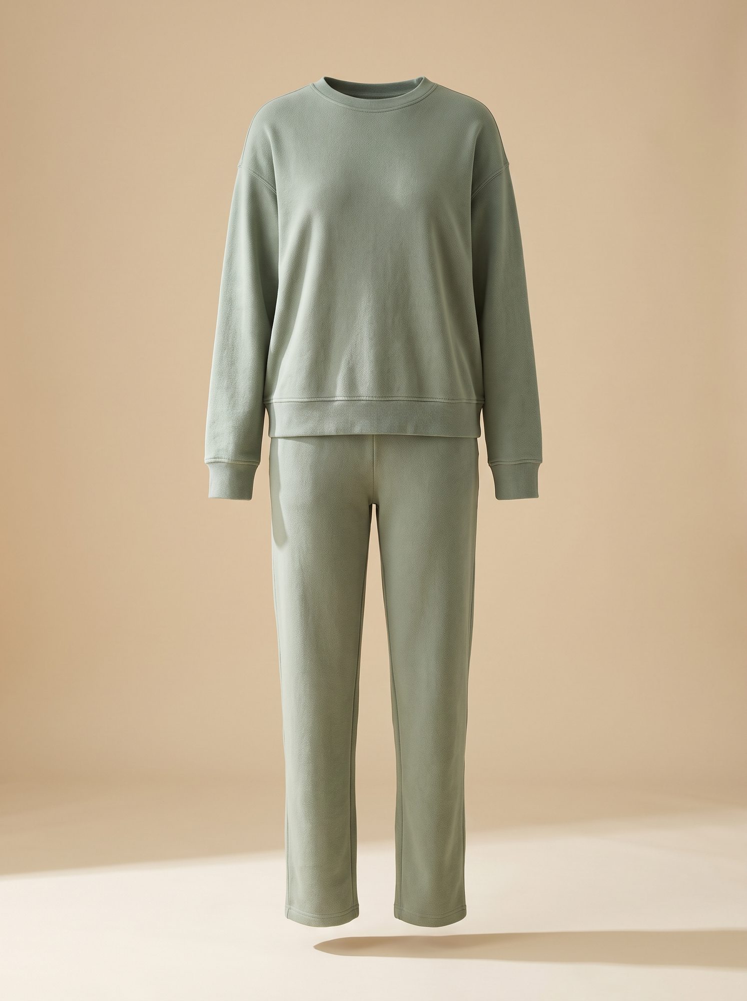 Sage green knit lounge set — cropped sweatshirt with a tapered jogger