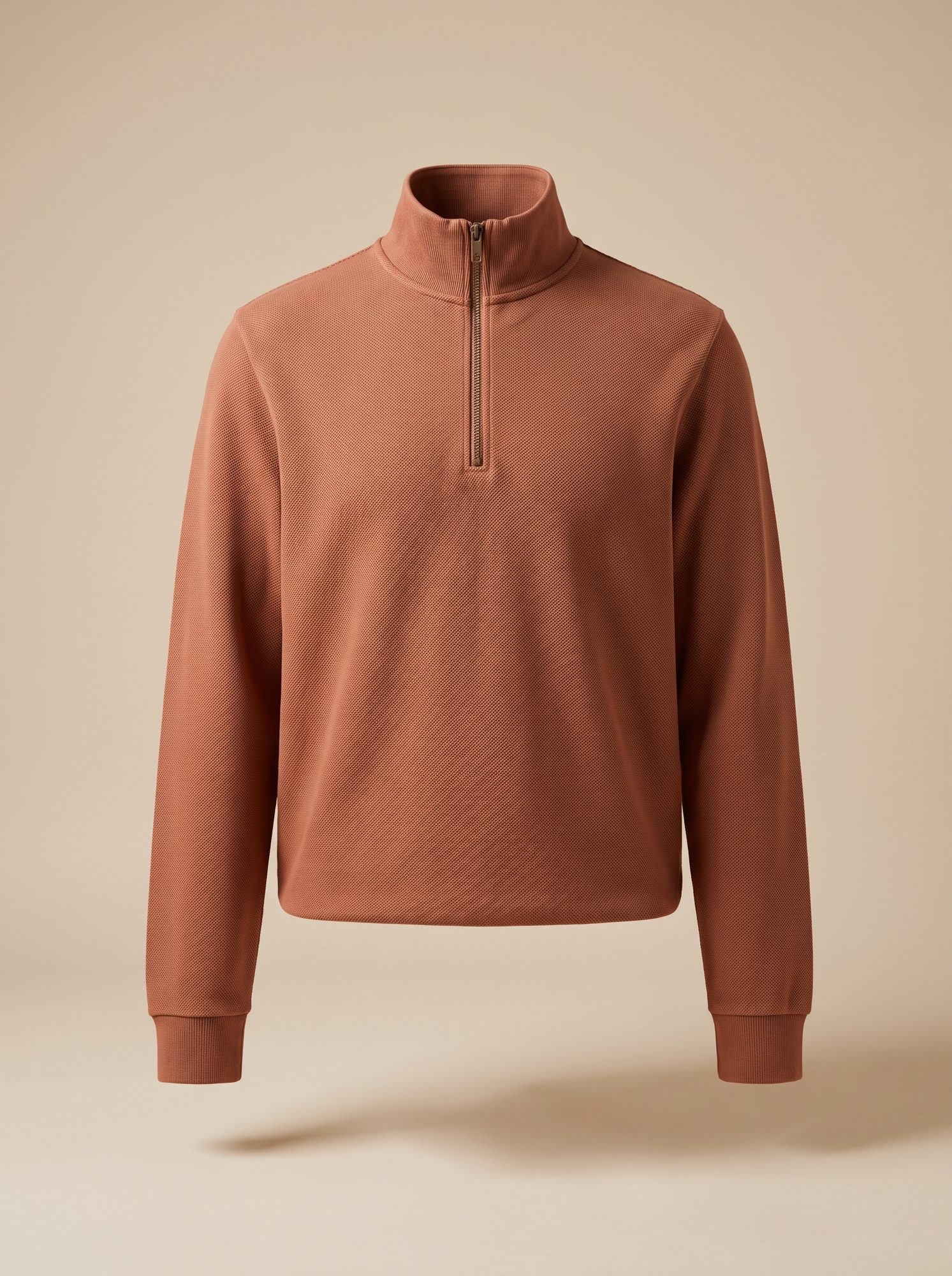 Clay-coloured half-zip terry sweatshirt with a funnel collar and ribbed cuffs